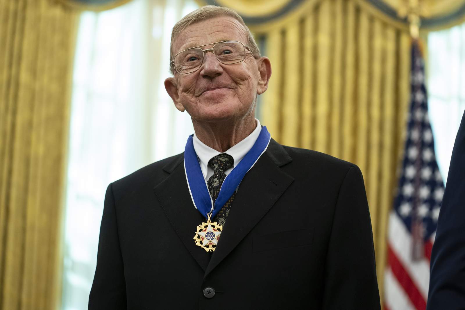 Trump honors football coach Holtz as 'one of the greatest'