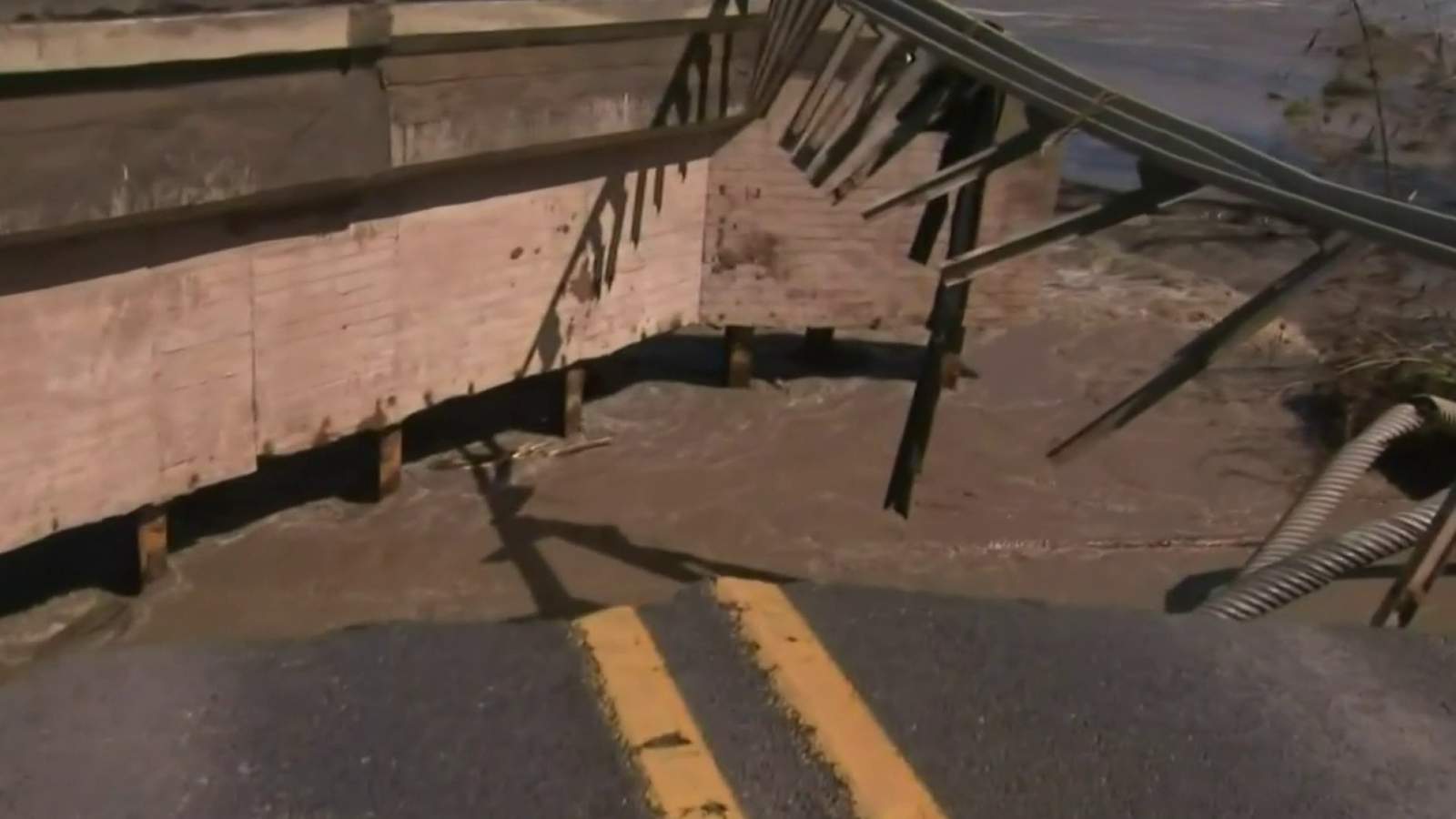 Flooding: Raging waters take out bridge in Edenville