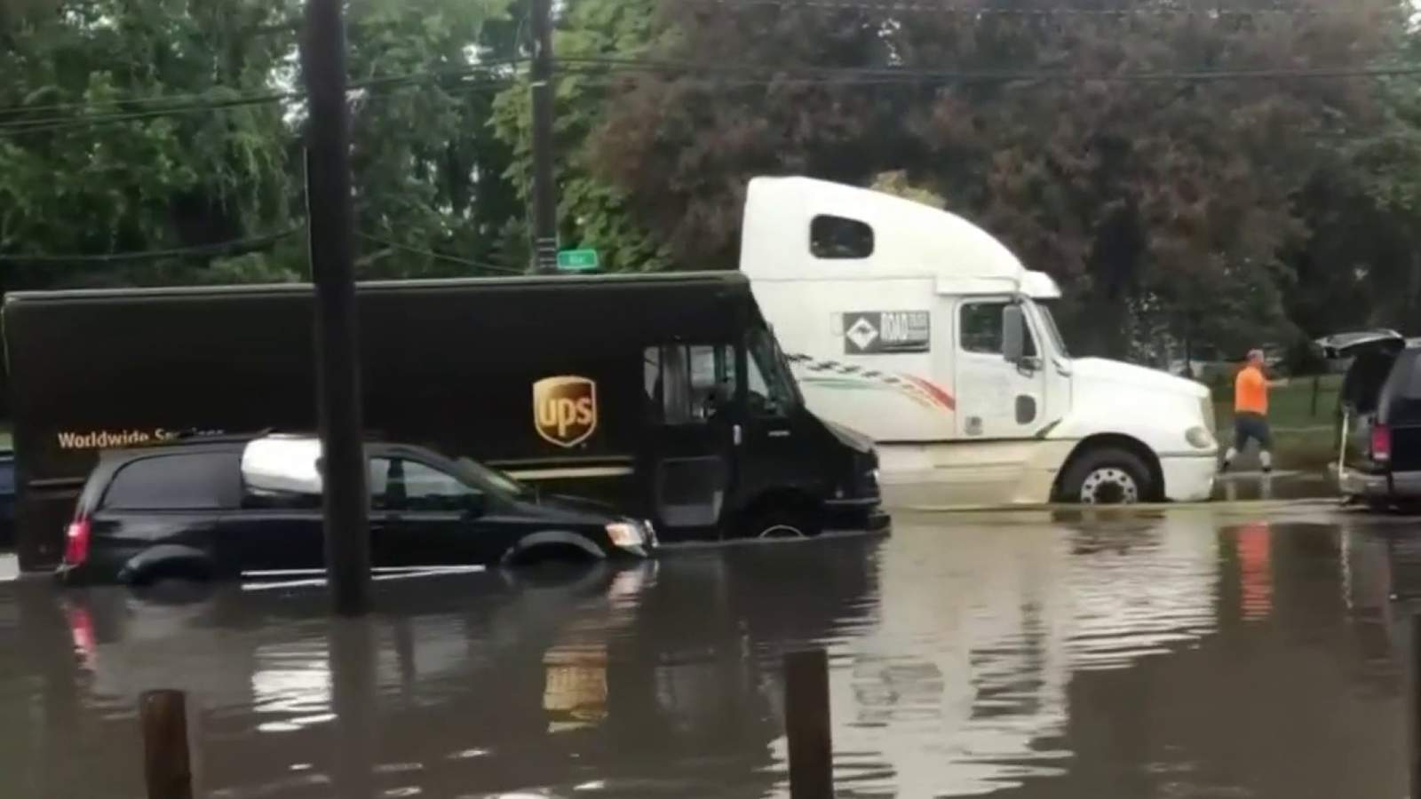 Multiple vehicles stuck on flooded roads in Detroit