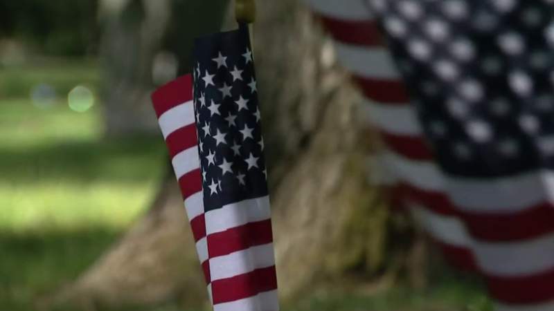 ‘Helping people who helped us’ -- Families place flags on graves of Metro Detroit veterans