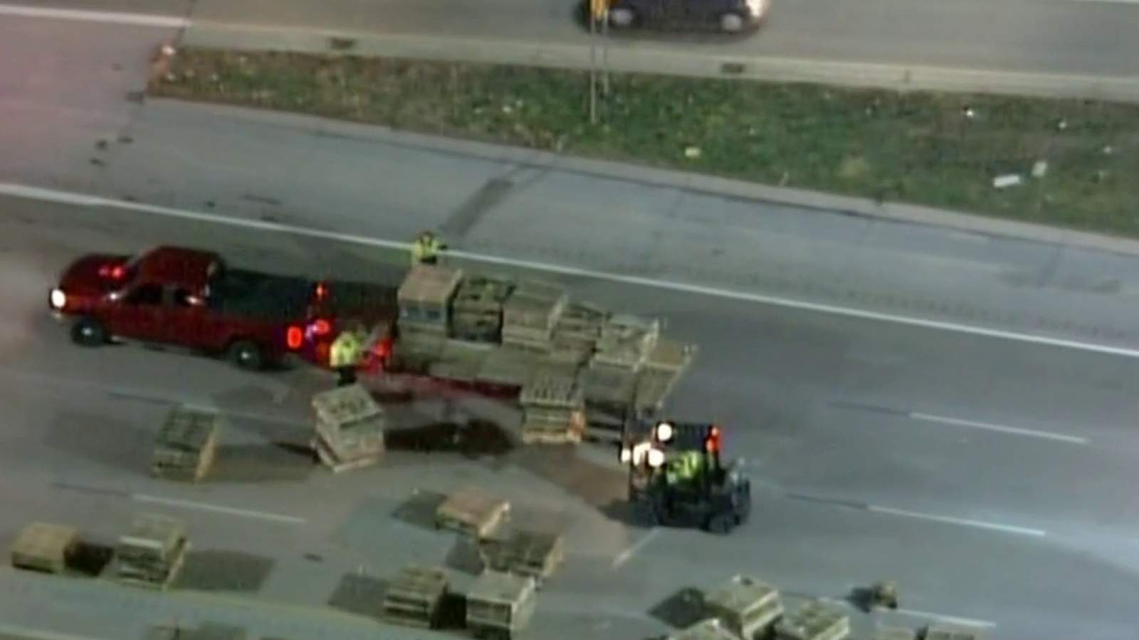 Wooden pallets cover westbound I-96 at Beech Daly Road