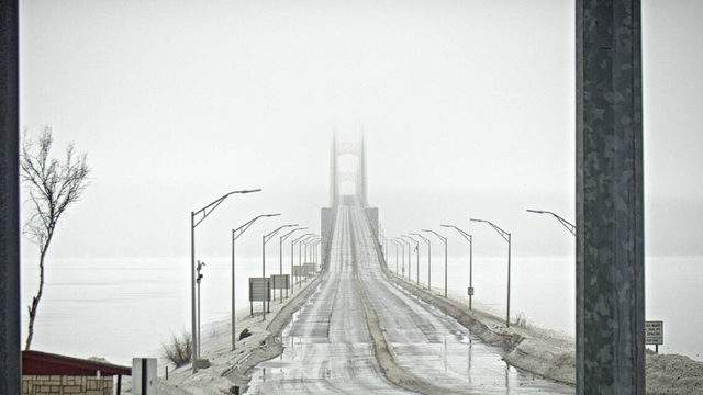 Michigan's Mackinac Bridge partially reopens after falling ice, blizzard  conditions