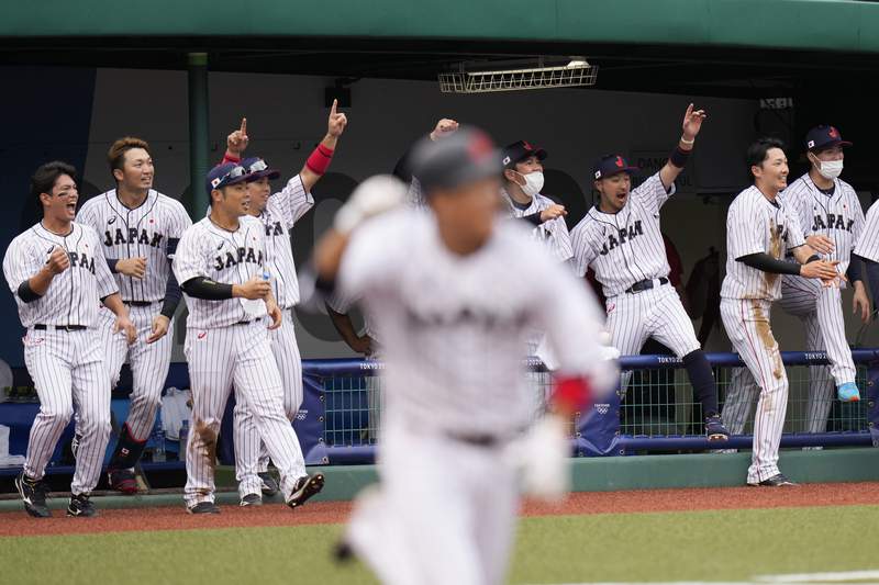 Timely bunt rallies Japan past DR in 9th in Olympic opener