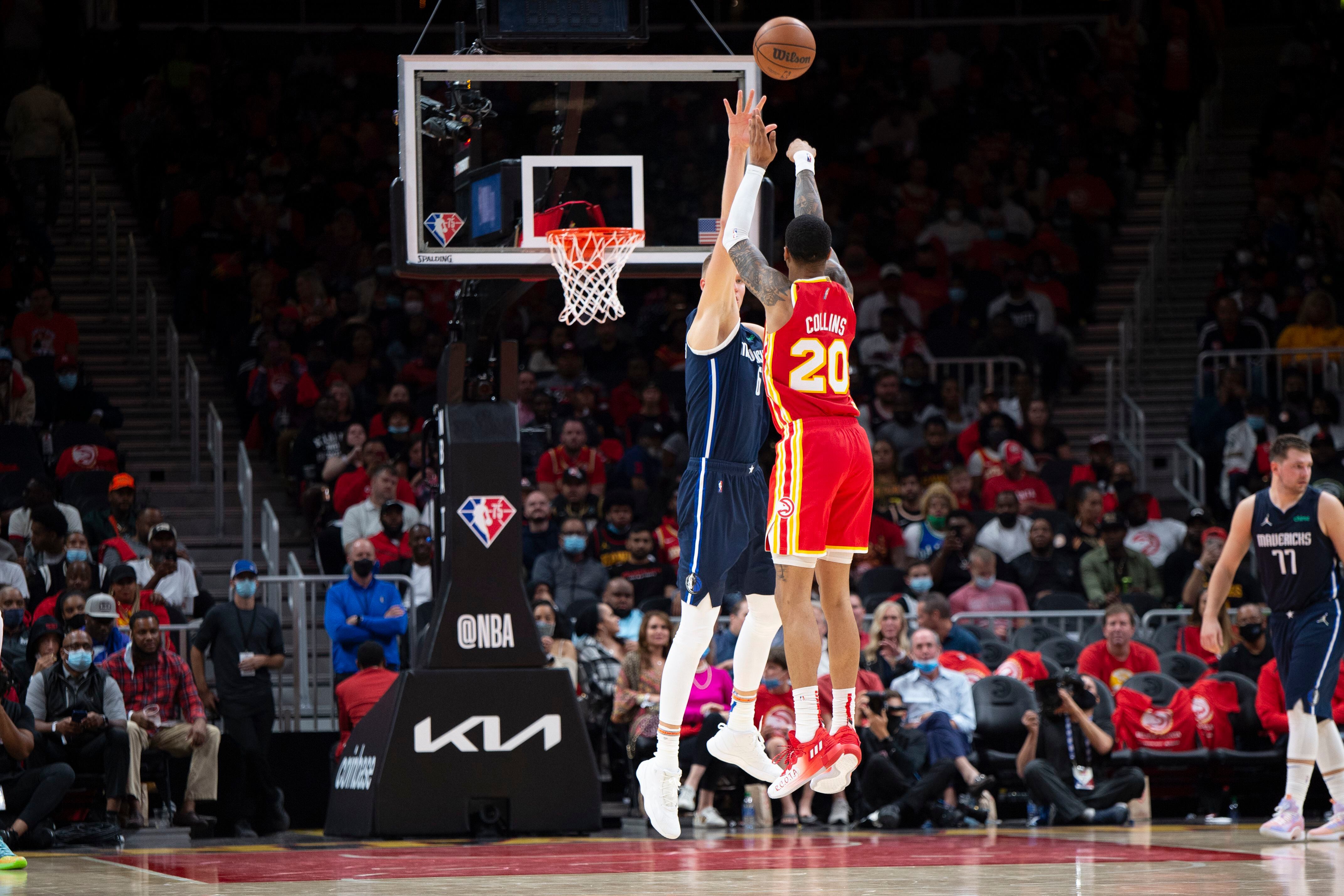 Young, Hawks open season with 113-87 rout of Mavericks