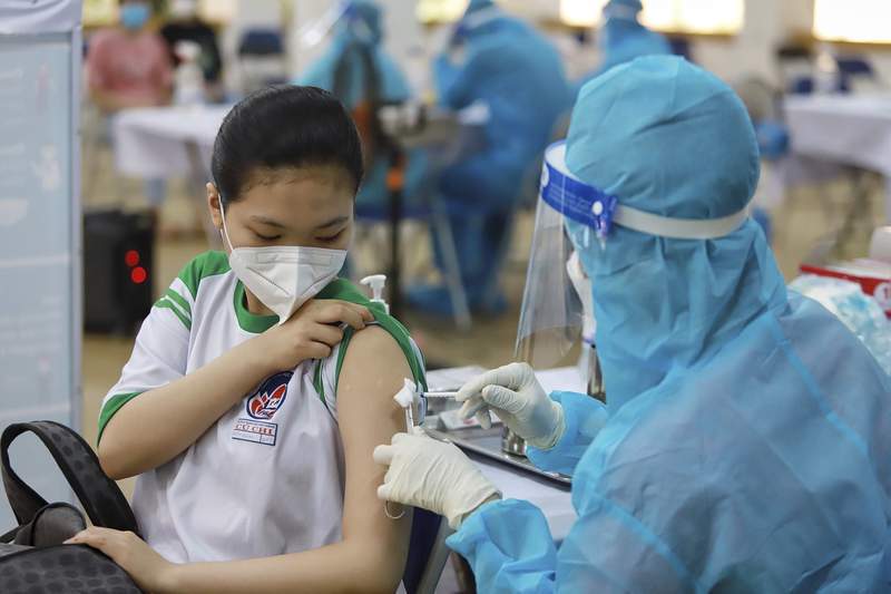 Vietnam starts vaccinating kids in effort to reopen schools