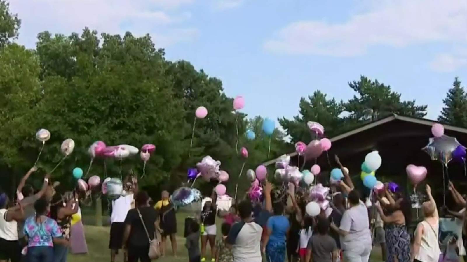 Family gathers in Redford park to pay tribute to daughters killed in house fire