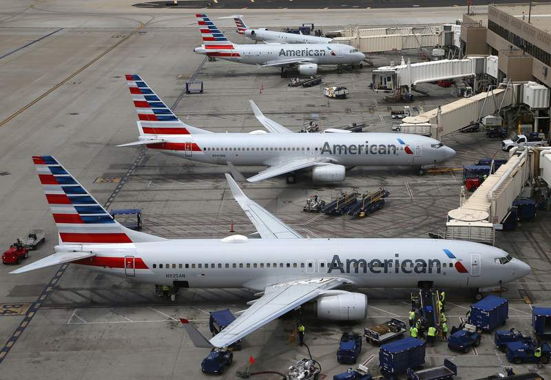 American Airlines posts $1.25 billion loss, delays new jets