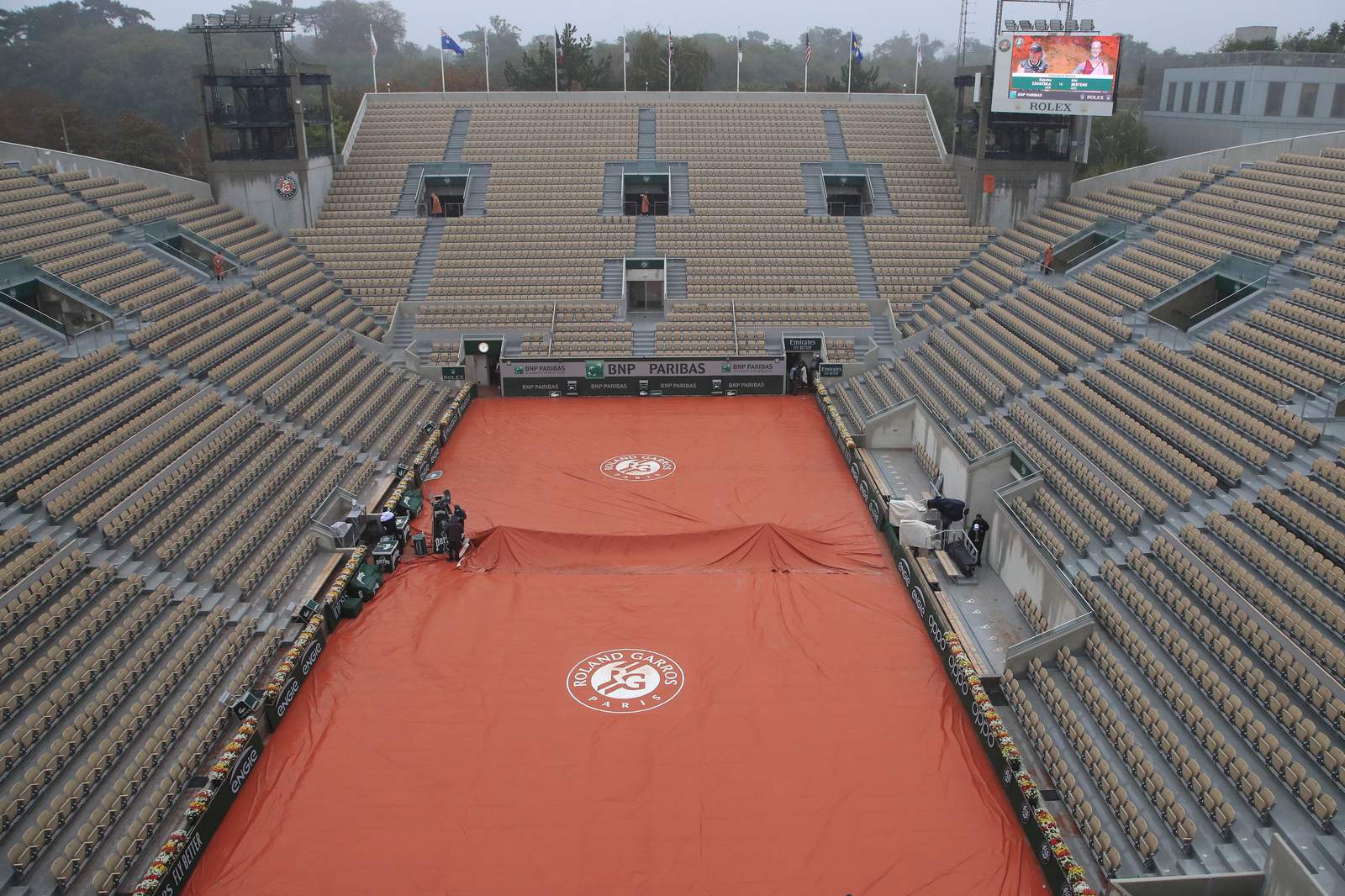 The Latest: Rain disrupts French Open, except under new roof