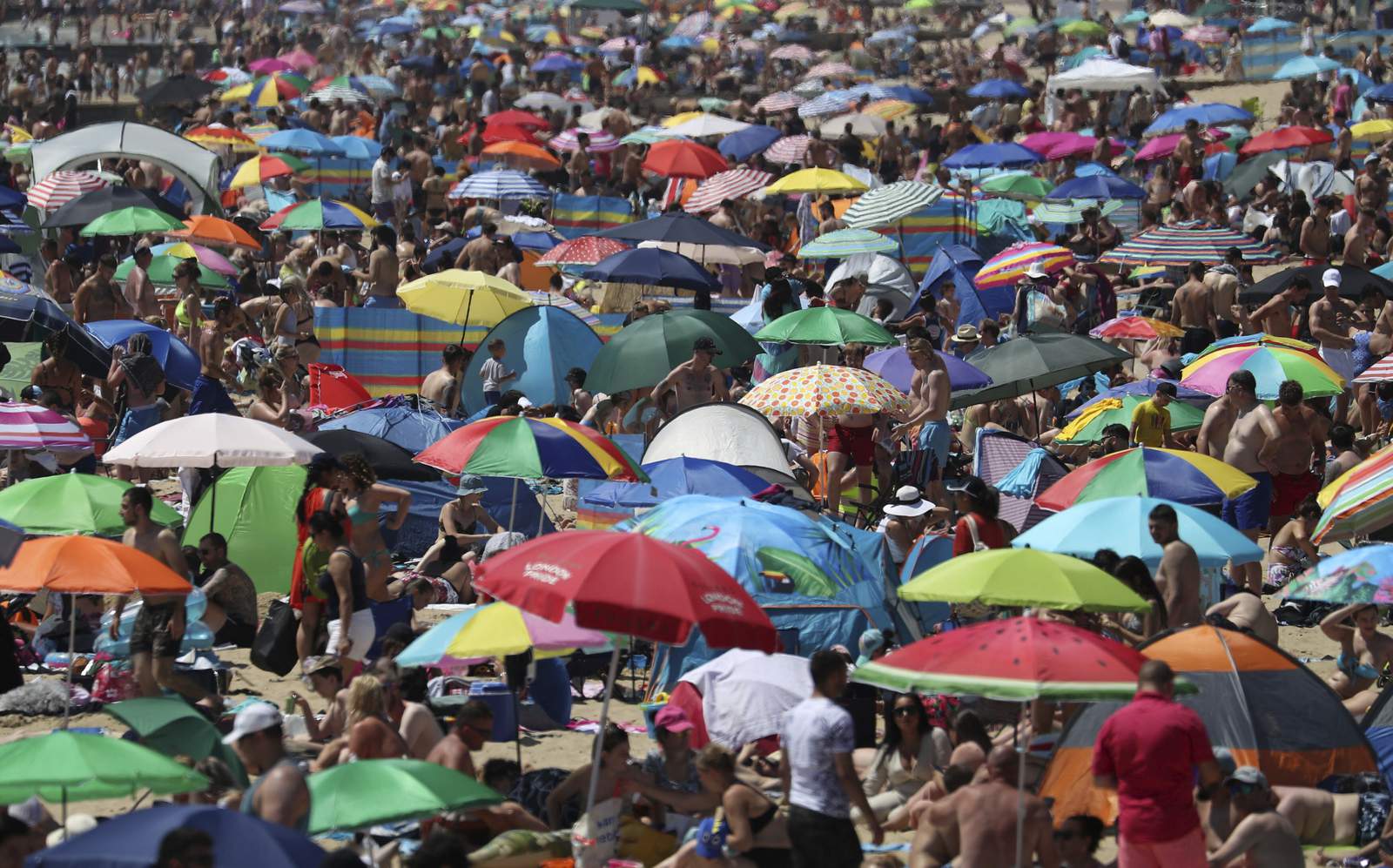 On hottest day of year, thousands cram onto English beaches