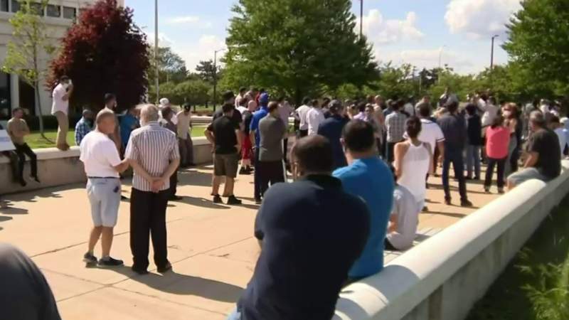 Protesters gather in Dearborn to demand compensation for flood damage to homes, businesses
